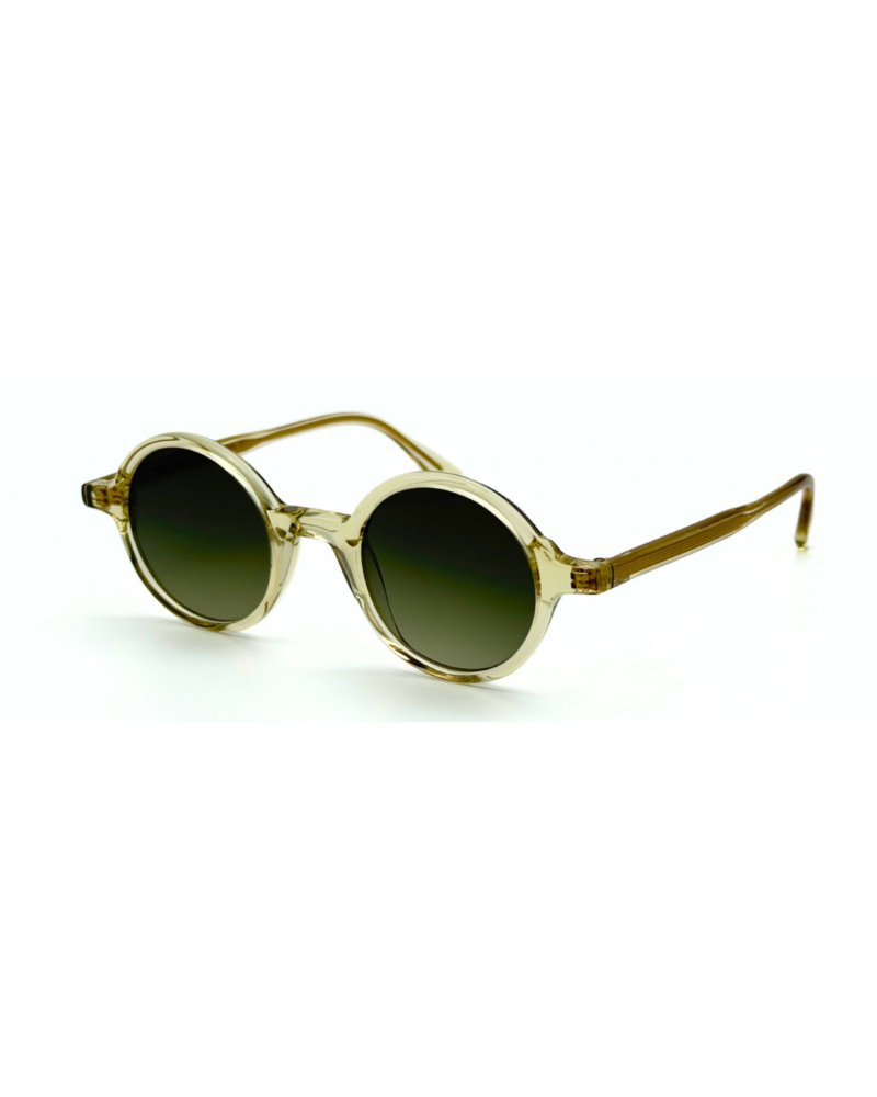 Lunettes de soleil de forme ronde Gigi Studios Greta acétate cristal champagne translucide et verres dégradés olive.