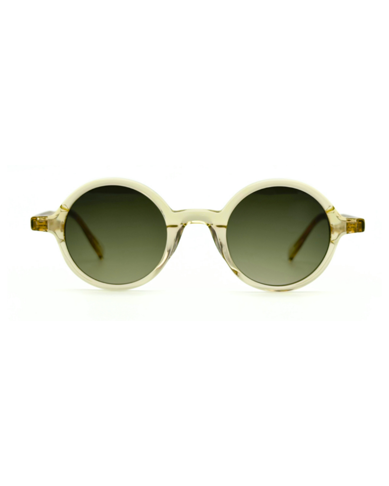 Lunettes de soleil de forme ronde Gigi Studios Greta acétate cristal champagne translucide et verres dégradés olive.