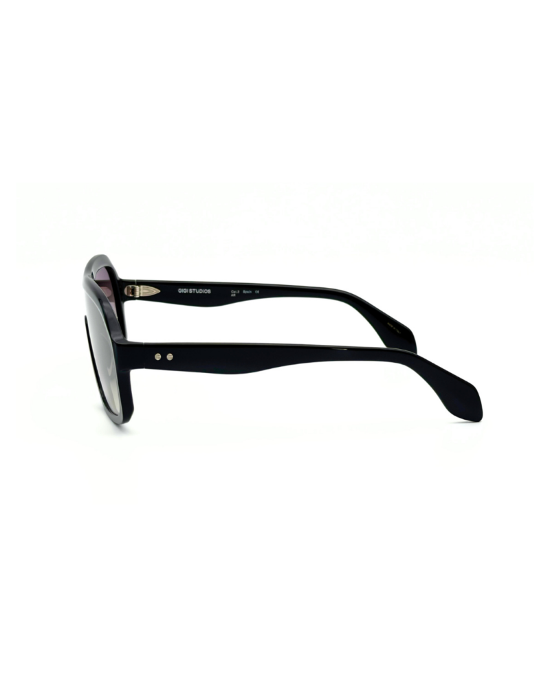 Lunettes de soleil oversized GIGI STUDIOS NAELLE GS1067/11 en acétate noir brillant avec verres dégradés gris antireflets.