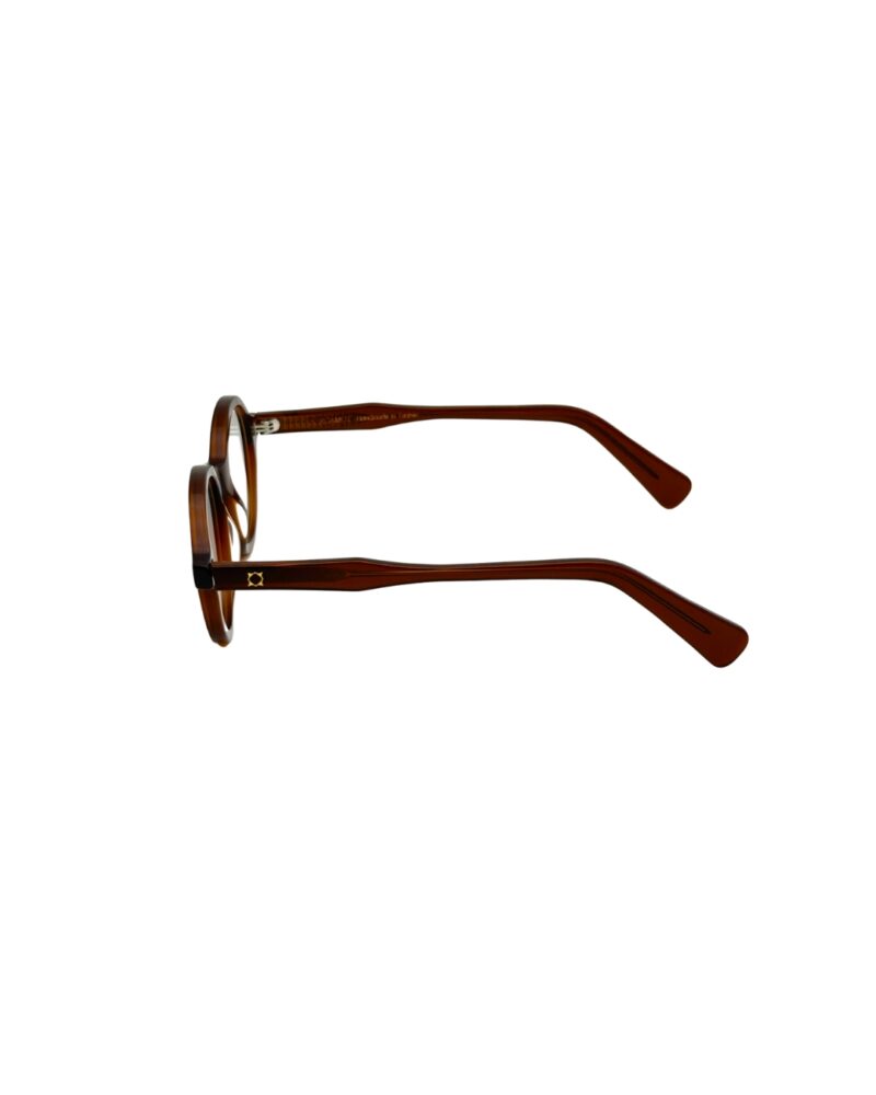 Branche de lunettes en acétate ambre BERGAMOT Punch ornée du logo géométrique doré.